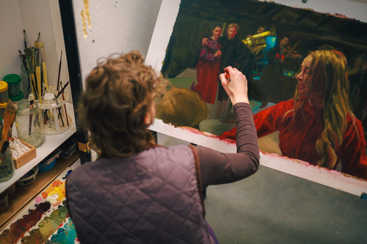 An artist painting of of the thousands of artworks used to animated the Peasants movie.