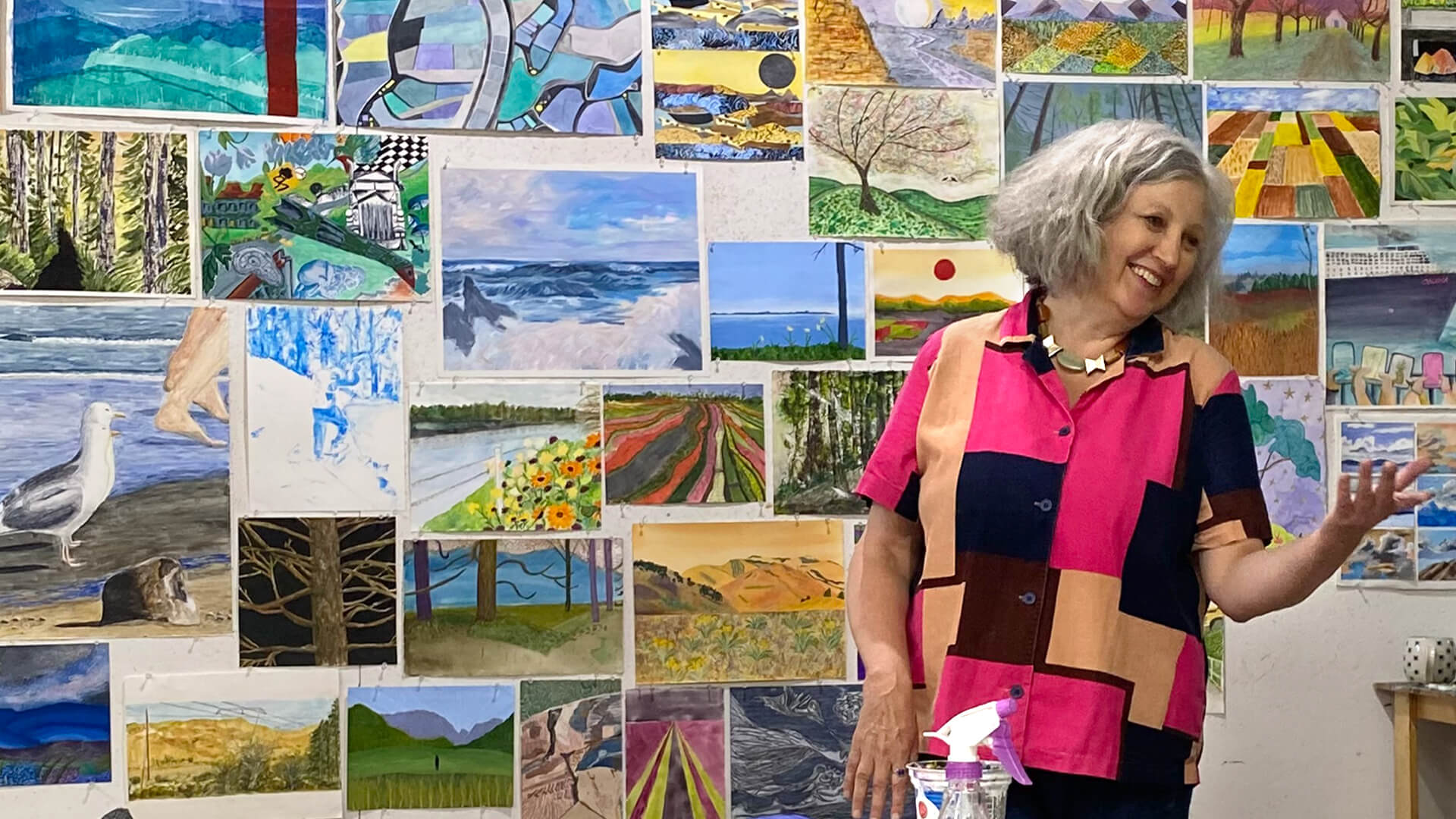 Wendy Welch with a backdrop of art at VISA